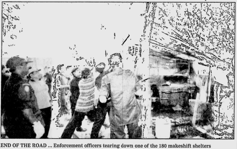 nst-20000216-limaumanis-officers-tearingdown.png