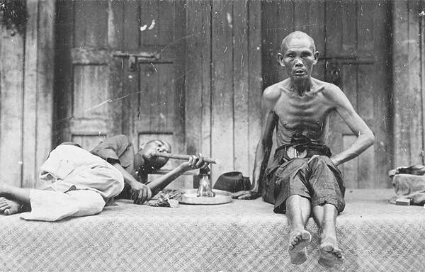 Emaciated Chinese labourers smoking opium, late 19th century–early 20th century. Courtesy of the National Museum of Singapore, National Heritage Board.